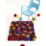 alfombra de pompones
