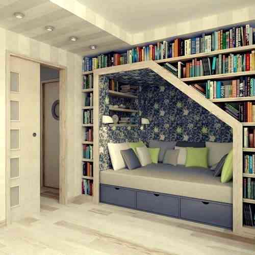 Bliblioteca y zona de descanso y lectura en una pared 1 biblioteca