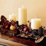 centro de mesa con vela sy piñones