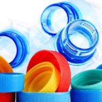 Composition with plastic bottles and caps