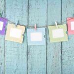 Five empty photo frames hanging with clothespins 2