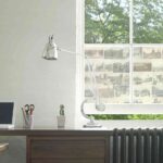 Closeup view of a study desk with laptop and lamp