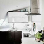 Ático de estilo nórdico zona cocción cocina 1200×899