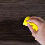 Hand dust the wood furniture