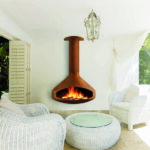 Cat sleeping in outdoor furniture on patio