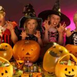 Halloween party with children wearing fancy costumes