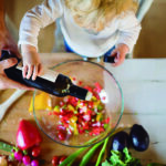 Young father with a toddler boy cooking.