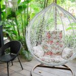 Vintage hanging chair with red seat