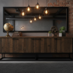 An industrial-style sideboard made of dark aged wood combined with black metal frame, placed in a mo