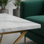 Close-up detail of a marble top corner table with gold metal legs, showing the beautiful veining pat