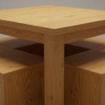 Close-up detail of wooden cube stools perfectly stored under a compact dining table, showing the tex