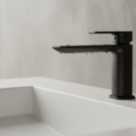 Close-up macro detail of a matte black minimalist bathroom faucet mounted on a white solid surface b