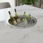 Close-up top view of a white Carrara marble dining table with a small circular refrigerator module r