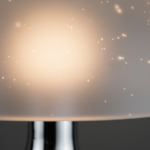 Extreme close-up macro detail of a translucent silicone lamp shade on a polished chrome metal stem,