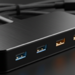 Extreme close-up macro detail shot of a premium aluminum anodized multi-port charging hub with USB-C and USB-A ports glowi…