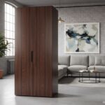 Compact foldable kitchen module closed like a wardrobe, elegant wooden finish, modern loft apartment