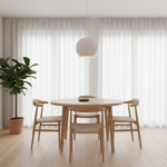 A cozy Nordic-style kitchen dining area with a round wooden table, light-toned chairs with minimalis