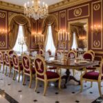 Elegant Napoleonic Empire style dining room with a long dark wood table, gilded chairs with eagle mo