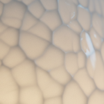 Close-up macro photograph of the textured surface of a white polyethylene outdoor designer lamp, sho