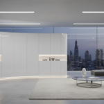 A sleek futuristic living room featuring a sculptural glossy white lacquered storage cabinet with as