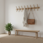 Elegant Scandinavian entryway hall with a beautiful wall-mounted wooden coat rack holding a wool coa