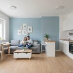 Small open plan living room and kitchen in a modern apartment, clever furniture arrangement, compact