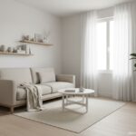 Bright and elegant small living room with light neutral colors, compact sofa, floating shelves, larg