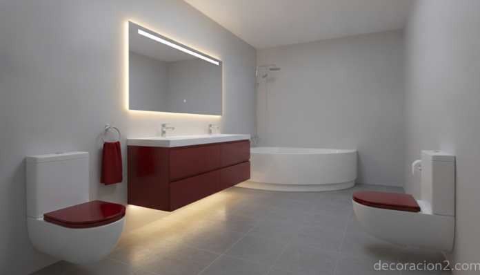 Baño de color moderno con sanitarios de la línea Kroma de Roca en acabado rojo