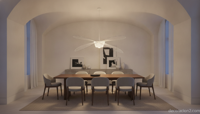 Lámpara Pirce de Artemide en espiral blanca suspendida sobre un comedor moderno