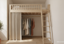 Cama elevada con vestidor debajo en un dormitorio pequeño de techos altos y madera clara