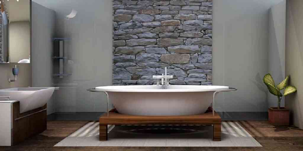 Entre las tendencias para el actualizar el baño en el 2022, tenemos los materiales naturales como la piedra y la madera.