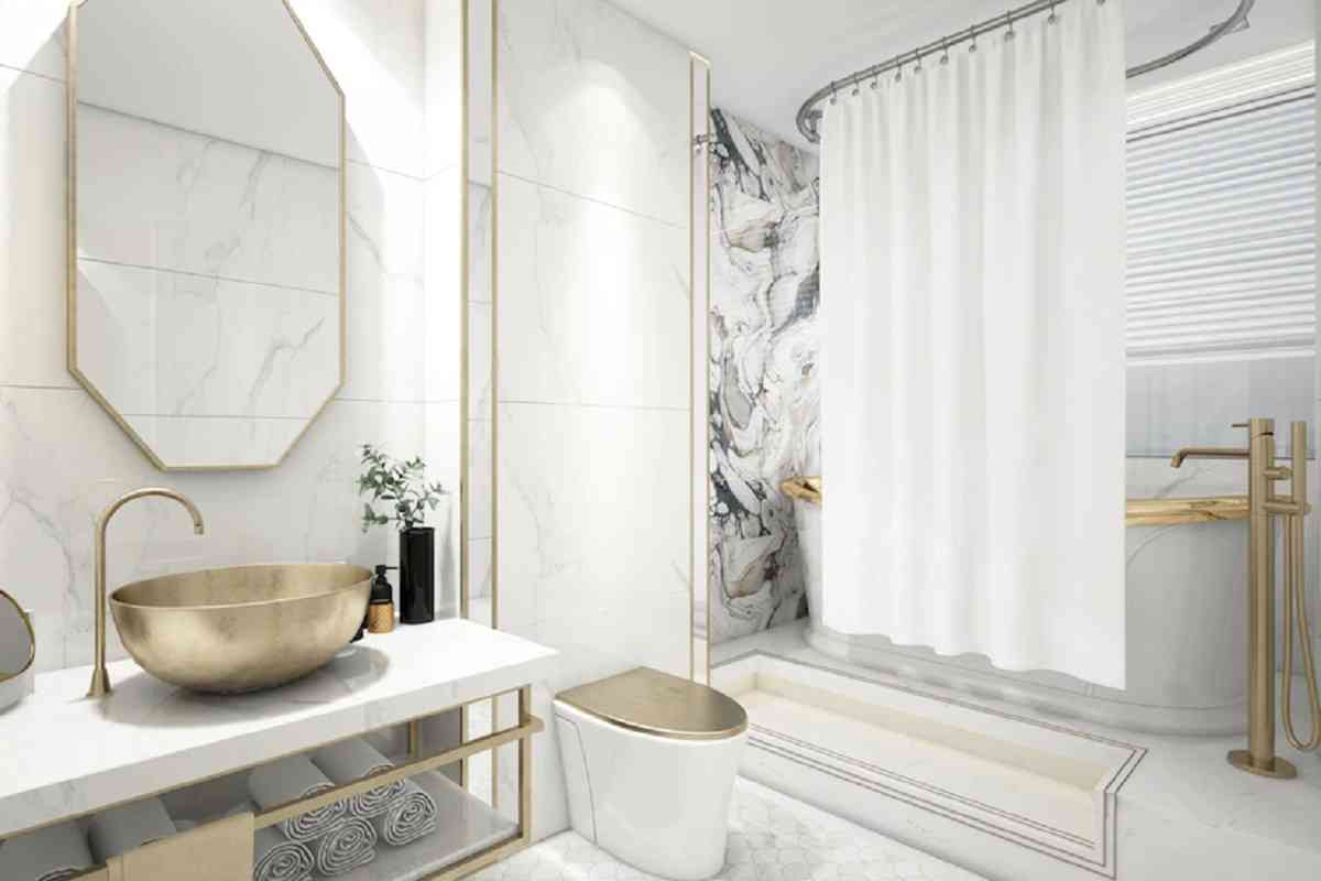 Las griferías doradas brindan un aspecto elegante y muy sofisticado a tu baño.